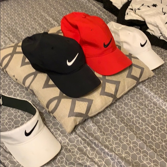 Nike Other - 4 Nike hats in good conditions hardly worn